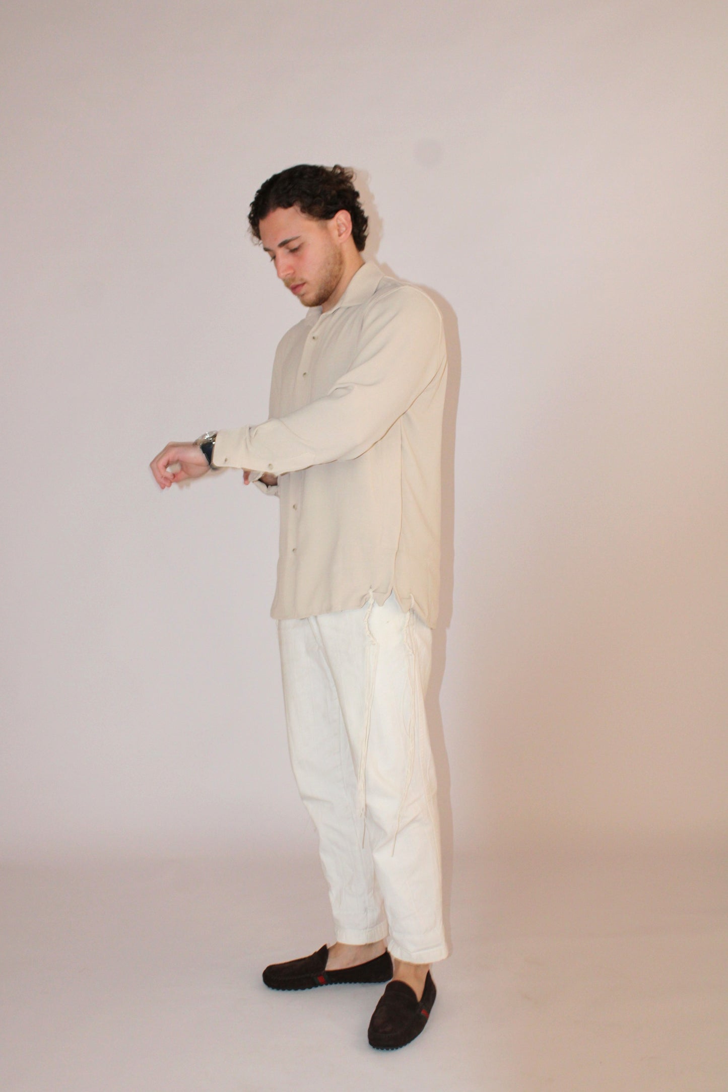model wear buttoned Tzitzit Beige from middle left side