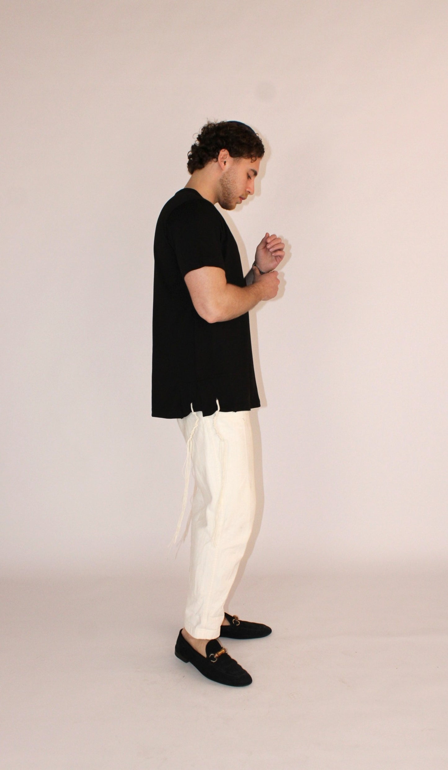 Model wears Classic Fit Charcoal Tzitzit T-Shirt from the right