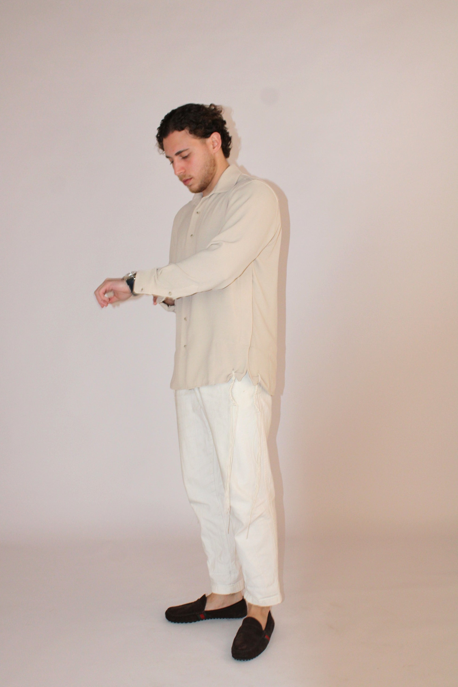 model wear buttoned Tzitzit Beige from middle left side 