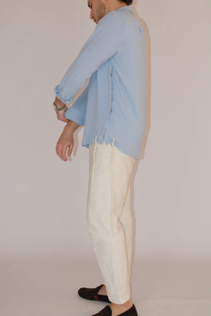 model wear buttoned Tzitzit Blue from side with look into the tzitzit