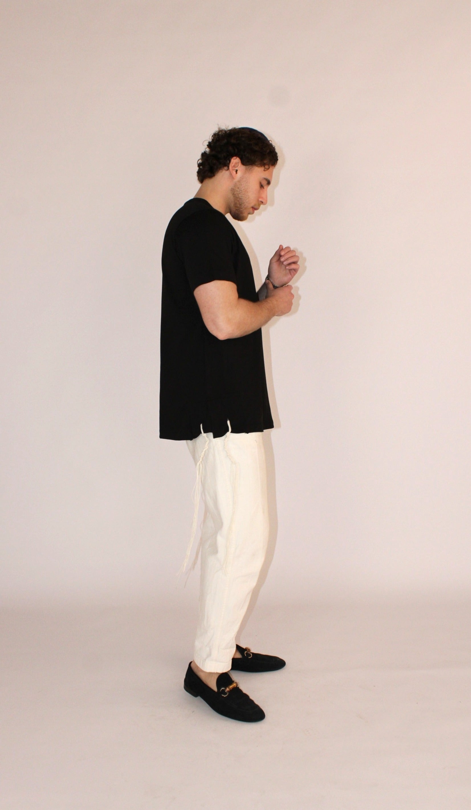 Model wears Classic Fit Charcoal Tzitzit T-Shirt from the right